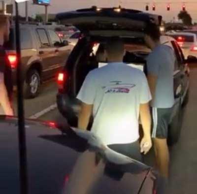 These guys playing Wii at a red light in Florida