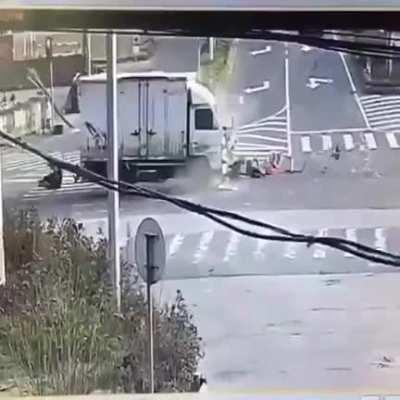 Motorcycle full of people hit truck