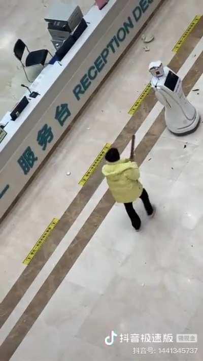 Rage Against the Machine - A woman smashes a robot in a hospital in China.