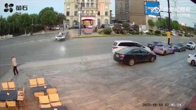 Motorcycle Rider Ends Up On Car Hood
