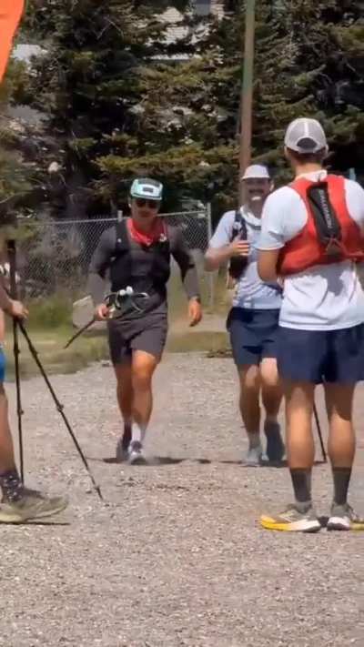 He waits for his three friends to cross the finish line of the Ultra Marathon together: