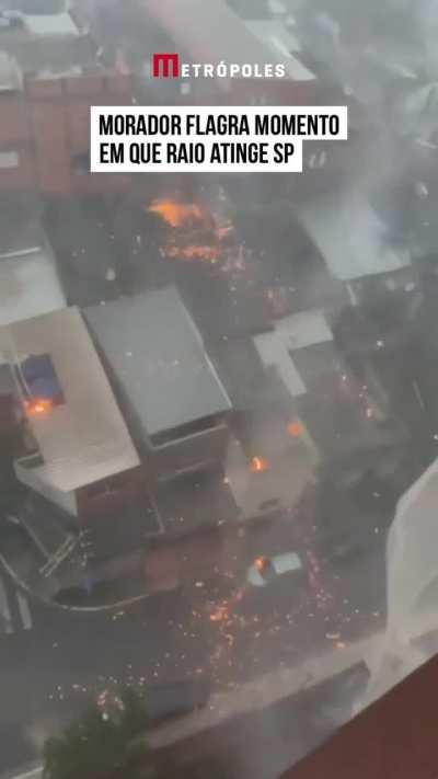 Moment when lightning hits the building and the houses around it...