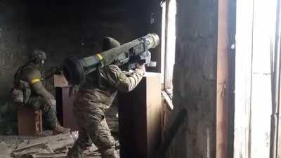 AFU FGM-148 Javelin operator fires from inside building on a Russian tank in Kherson direction