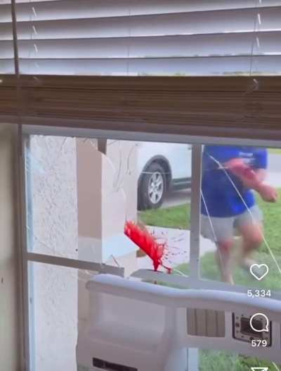 Man has a major freakout and punches through glass window 