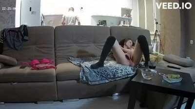 Sneaky masturbation on the couch while her BF do the dishes