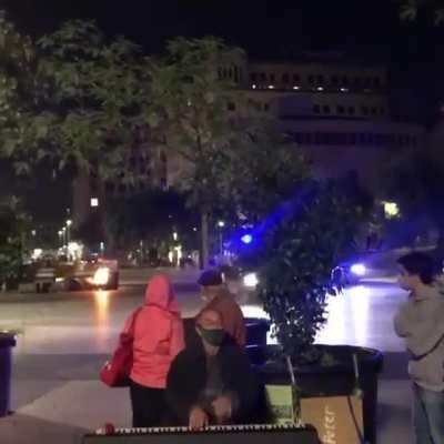 Piano player calmly keeps on playing during a heated protest in Barcelona