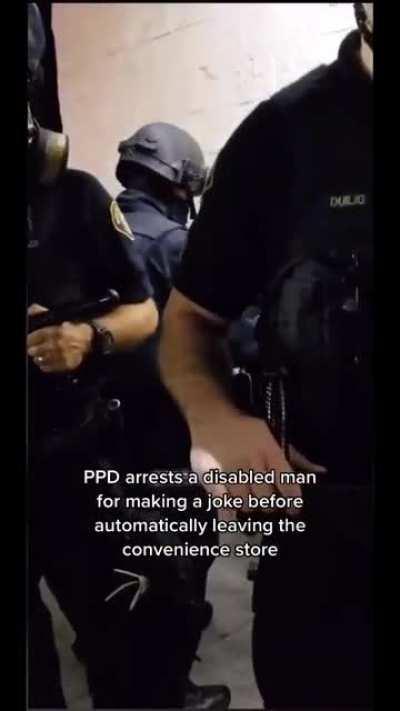 Cop manhandling a handicapped guy