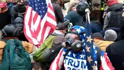 [Parler Leak] New CLOSE UP footage of men who were dragging and beating police officer with American flag at door to Capitol. 