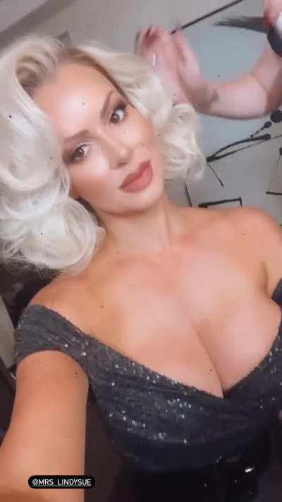 Getting her hair and makeup done