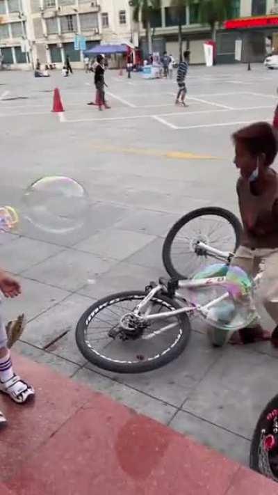 Kid bike stunt into another kid's leg!