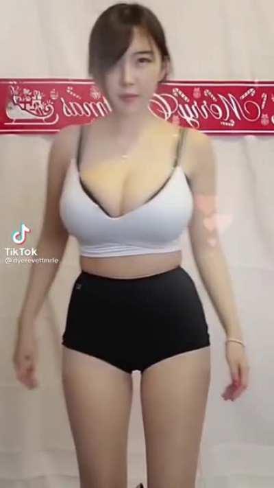 Busty Korean takes off shorts