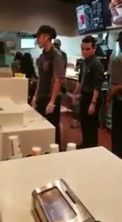 McDonalds employee gives a customer the McHands free of charge