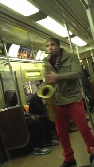 A sax battle between random subway users