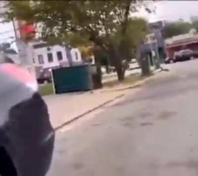 Guy tips over a porta potty with a girl inside