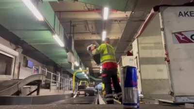 This human garbage handling your luggage