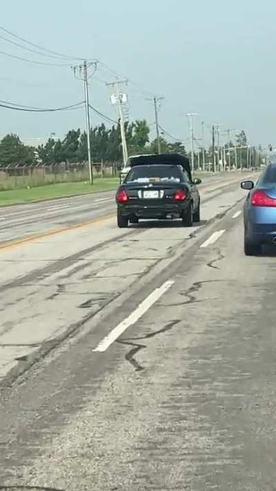 Dude drives with his hood completely covering his hood.
