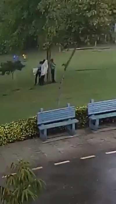 Standing under a tree