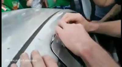 Irish Soccer Fans Fix Dented Car & squeeze money into the door of the car so the owner can pay for repairs.