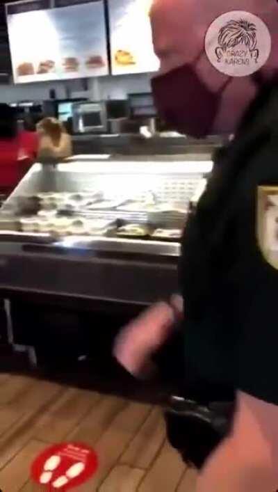 Security officer tries to remove antimask covidiot Karen from a Bagel Bros store, and Karen screams that she's being kidnapped