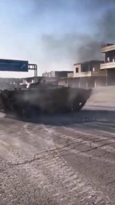 Syrian rebels drifting with captured SAA BMP