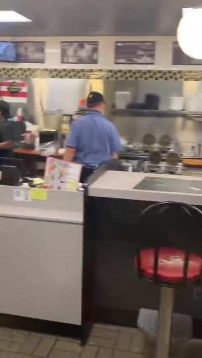 Waffle House employee casually blocks thrown chair