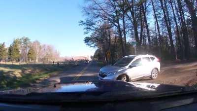 This Karen honks back at me after pulling out from her driveway which almost caused an accident! Luckily I wasn't driving fast as I was coming up on a sharp corner. If I was going the speed limit instead of slowing down early, I would've wrecked.