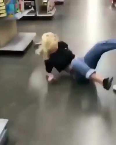 Testing a skateboard out on a shiny shop floor