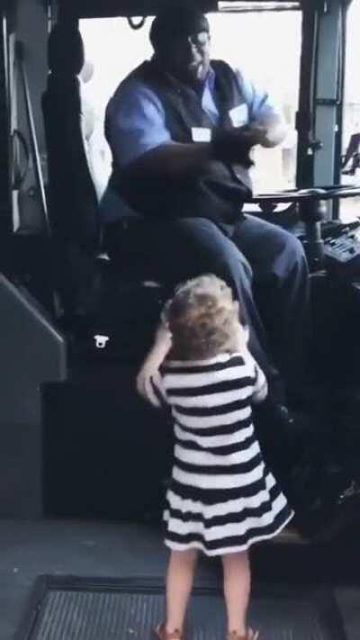 This bus driver and child vibing together