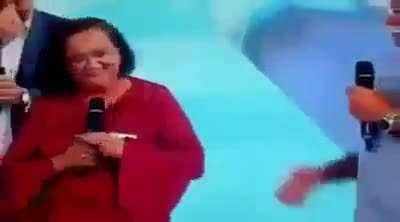 Woman's reaction when an Brazilian TV show fixed her car.