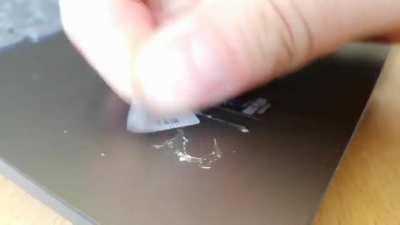 Removing the glue residue from a sticker