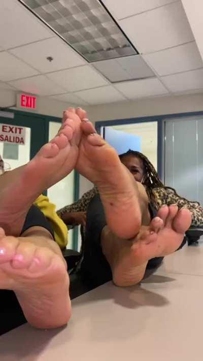 Two nurse showing their feet at work 