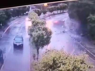 Driver loses control on wet road