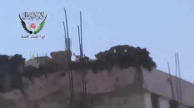 Sunni Youth Brigade fighters spend a lot of time & ammunition to disable a Syrian Army rooftop MG - 2014
