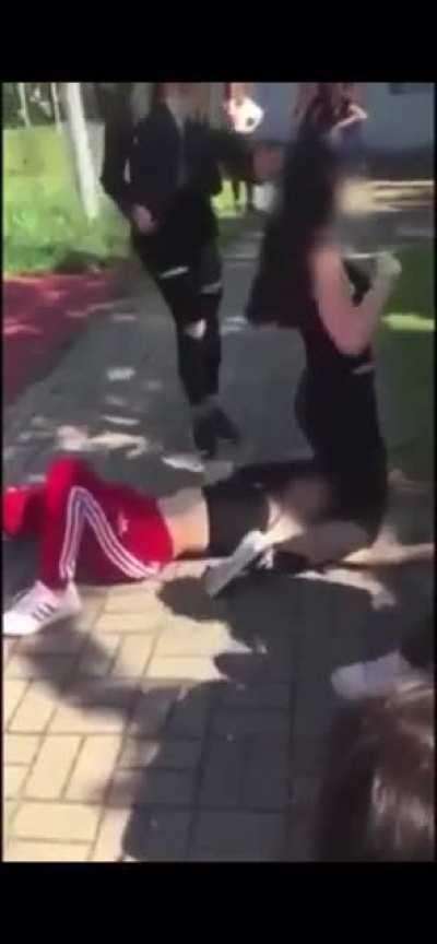 Girl pins and humiliates opponent in public.