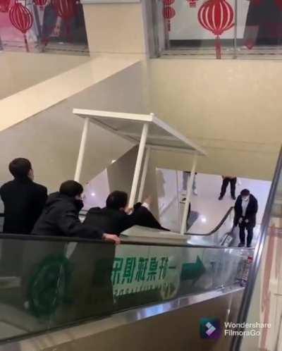 to move a cart down the escalator