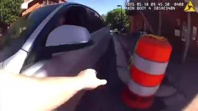 Woman drives through a festival to get to work