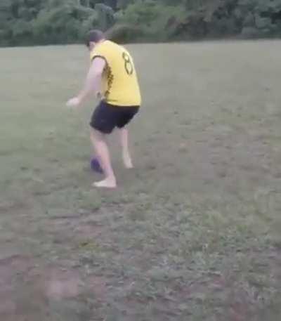 Playing soccer with a biwling ball.