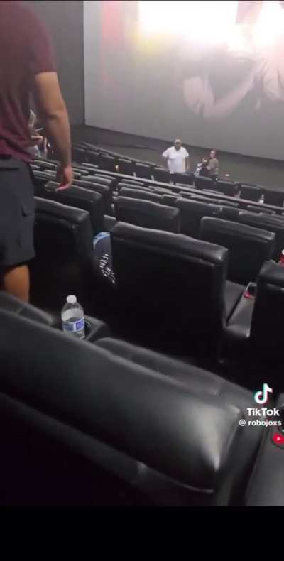 Dude literally has the piss beaten out of him for standing up and urinating during a screening at the cinema.