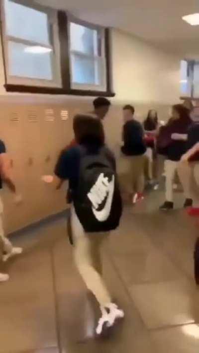 This dude breakdancing while there is a fight