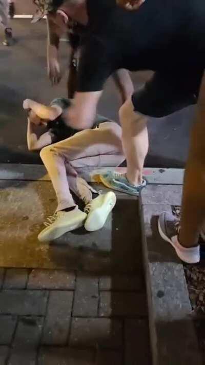 A guy was trying to break the glass of the Bank of America corporate office -- trying to incite the crowd to destroy uptown Charlotte. Instead the people were not going to let anyone destroy anything. The right way to protest.