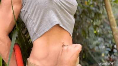 Me dressed as Lara Croft while they tease my belly button