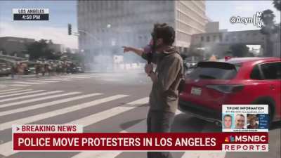 MSNBC reporter in gas mask in Los Angeles: 