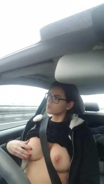 Beautiful Girl Playing with Her Tits While Driving