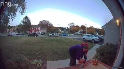 Lady steals ALL candy from multiple houses caught on Ring and blames her kid when caught.