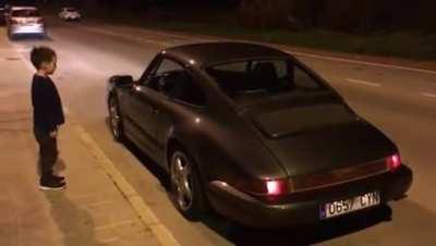 Kid falling in love with a Porsche