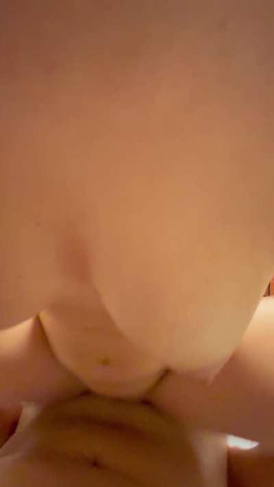 Grabbing her tits while she rides me