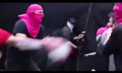 Protestors fight it out with iron pan