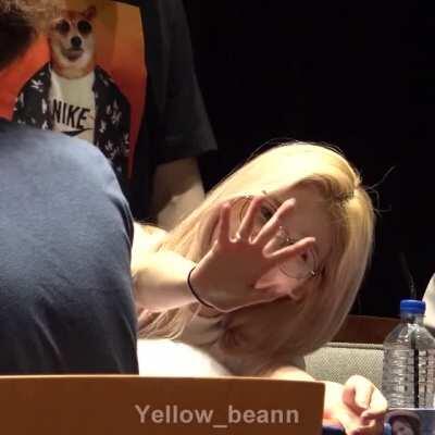 Sana spots the camera