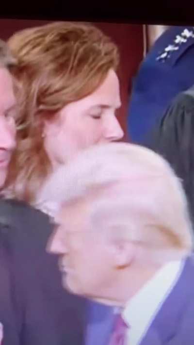 Supreme Court Justice Amy Coney Barrett with a look of total disgust on her face when seeing Trump