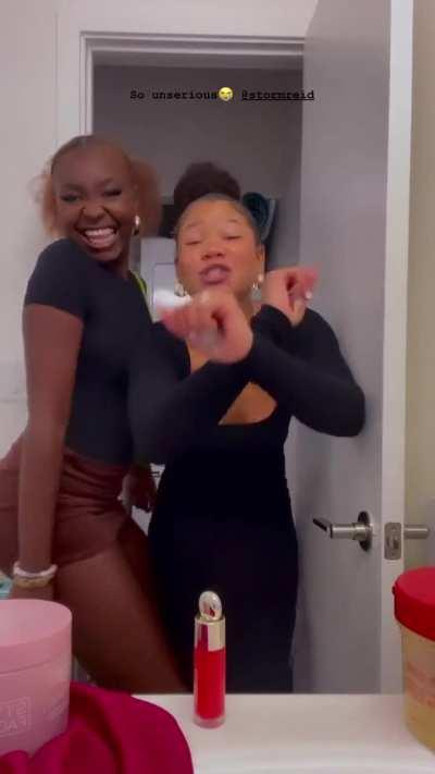 Dancing with her friend 